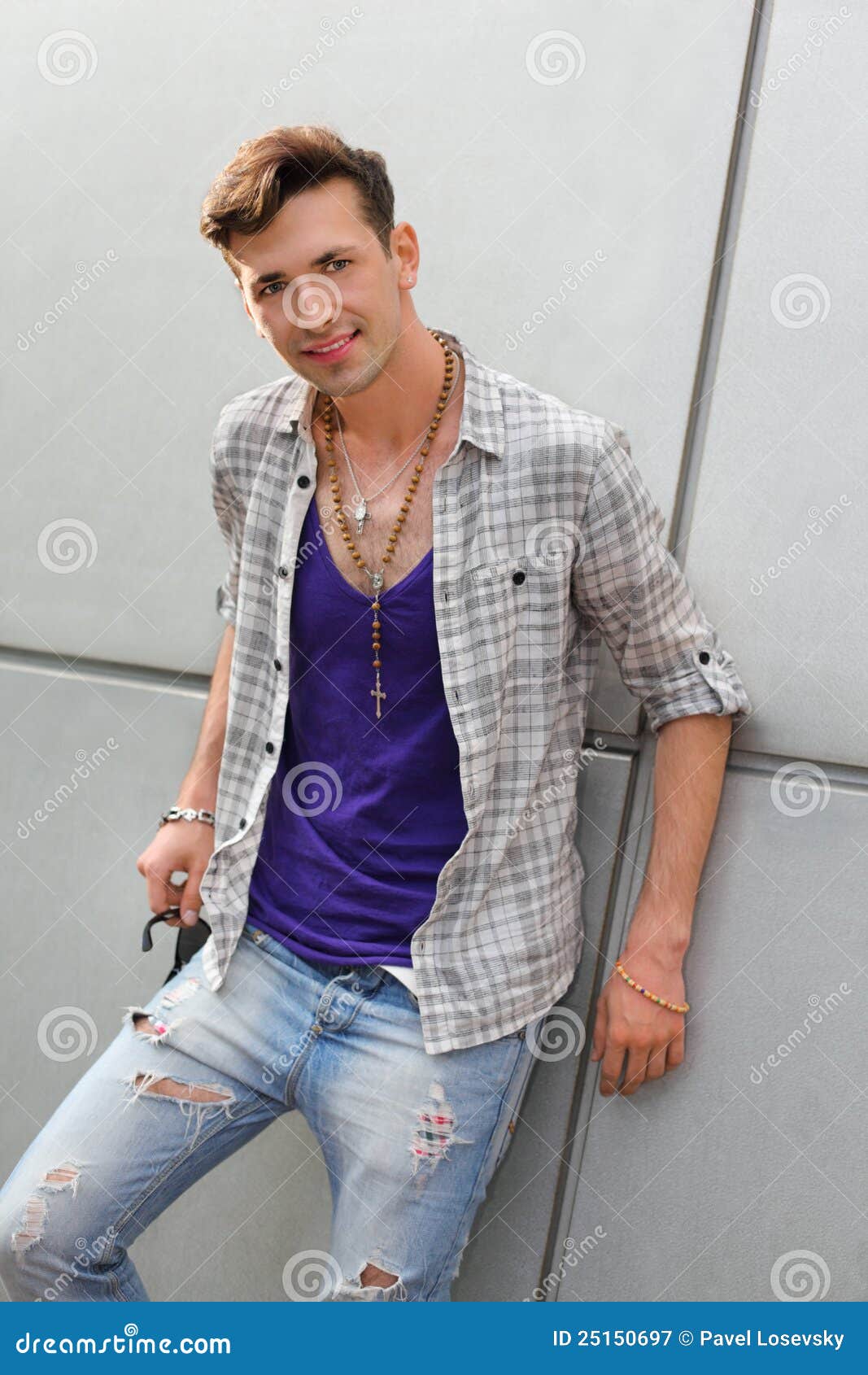 smiling-freak-man-wearing-ripped-jeans-stands-25150697.jpg