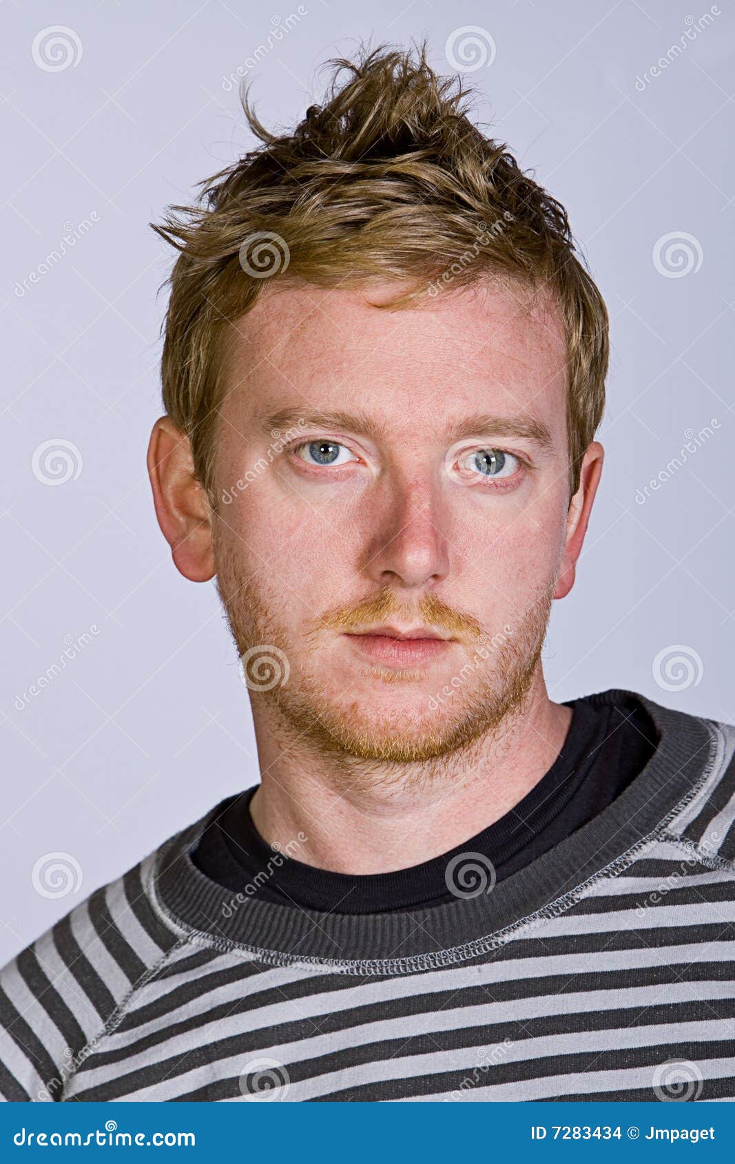 red-headed-male-against-grey-background-7283434.jpg